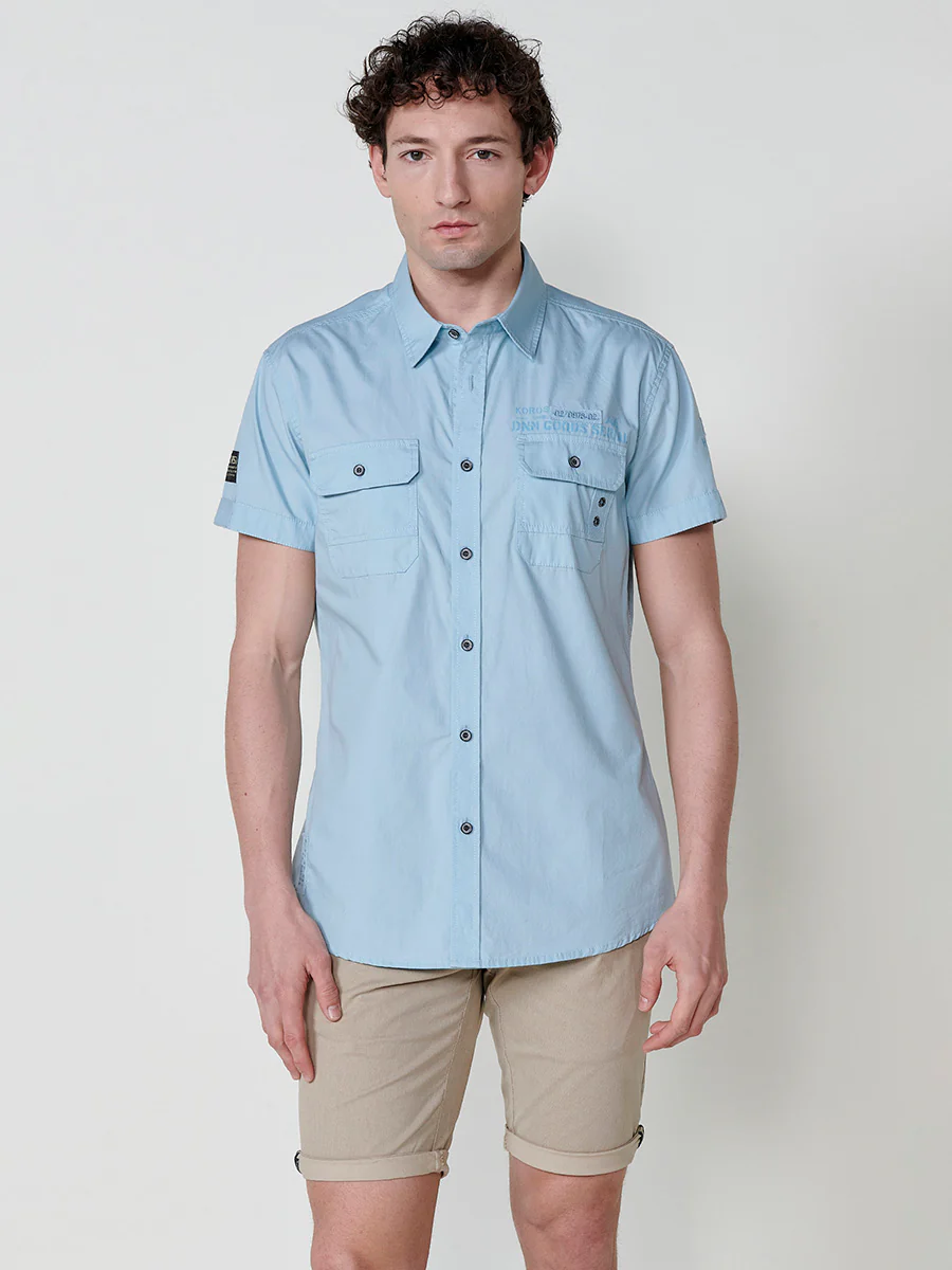 Camisa de manga corta de algodón con acabado en vuelta. cierre con botones. bolsillos con solapa. color azul para hombre - Image 14