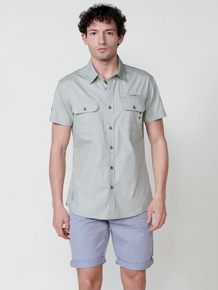 Camisa de manga corta de algodón con acabado en vuelta. cierre con botones. bolsillos con solapa. color azul para hombre - Image 21