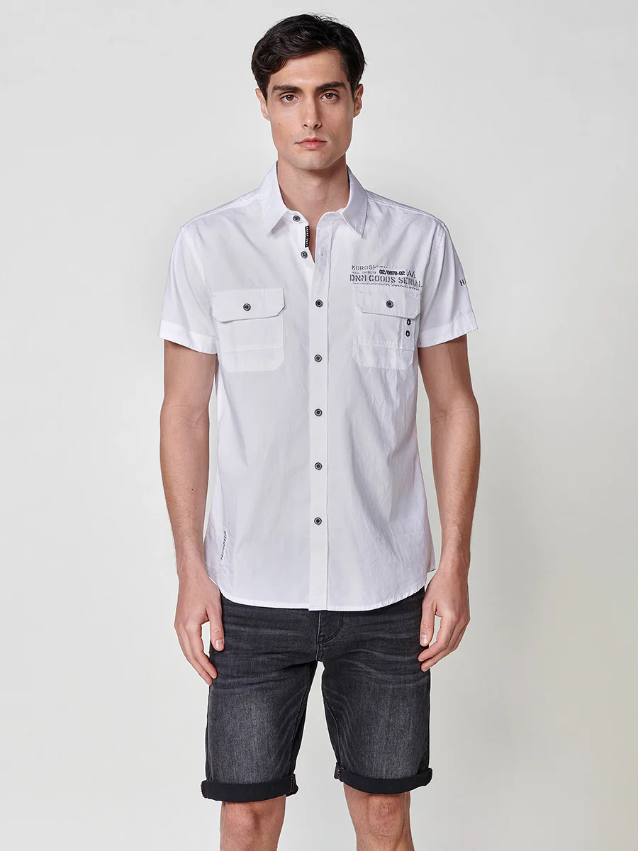 Camisa de manga corta de algodón con acabado en vuelta. cierre con botones. bolsillos con solapa. color azul para hombre - Image 5