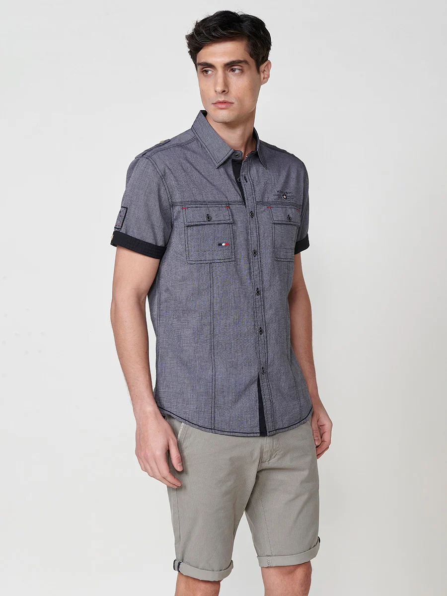 Camisa de manga corta de algodón. puños vueltos, cierre con botones y bolsillos con solapa. - Image 13