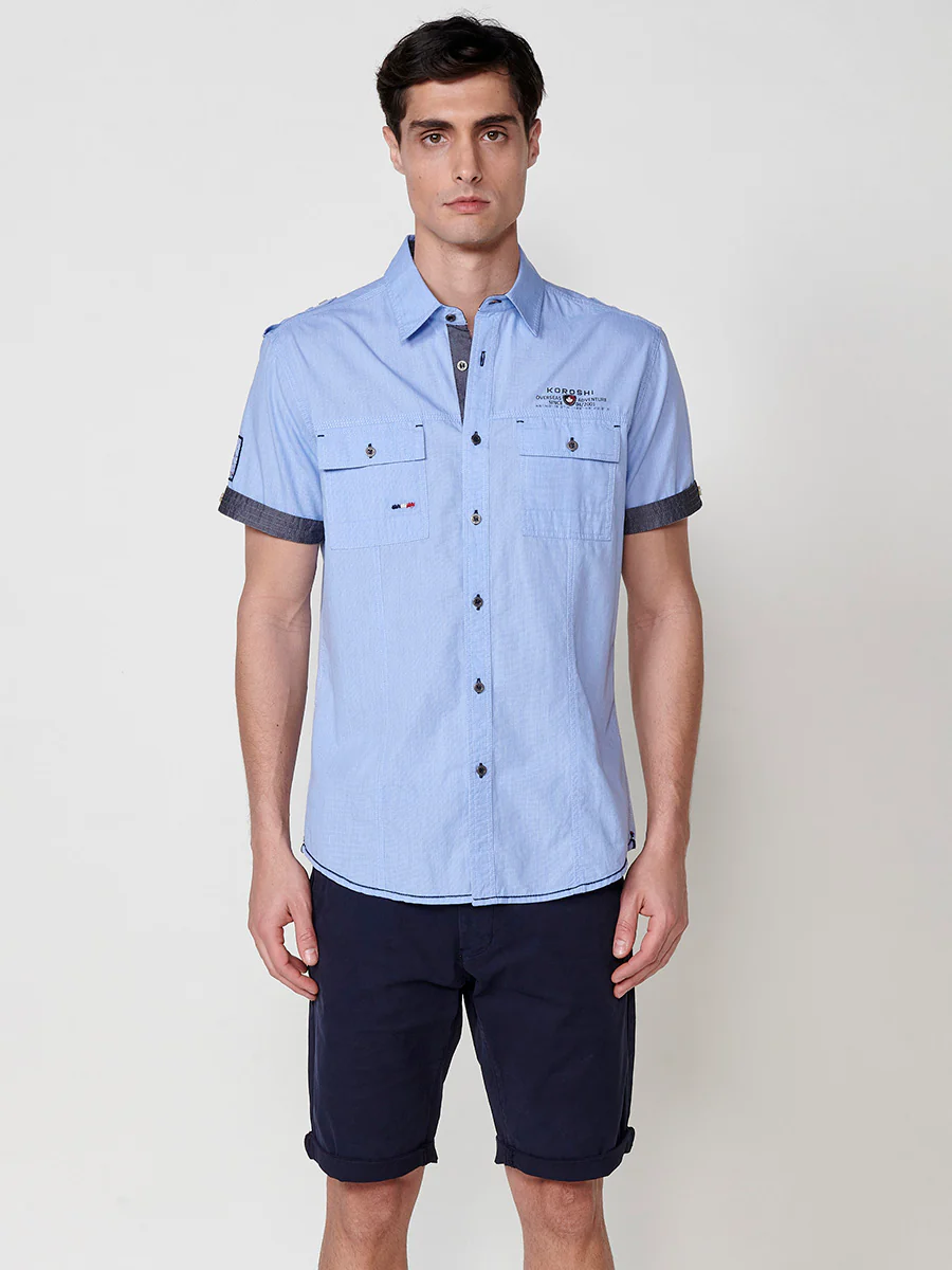 Camisa de manga corta de algodón. puños vueltos, cierre con botones y bolsillos con solapa. - Image 17