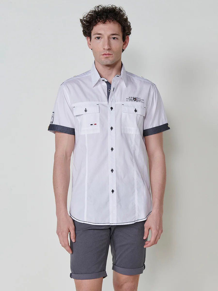 Camisa de manga corta de algodón. puños vueltos, cierre con botones y bolsillos con solapa. - Image 4