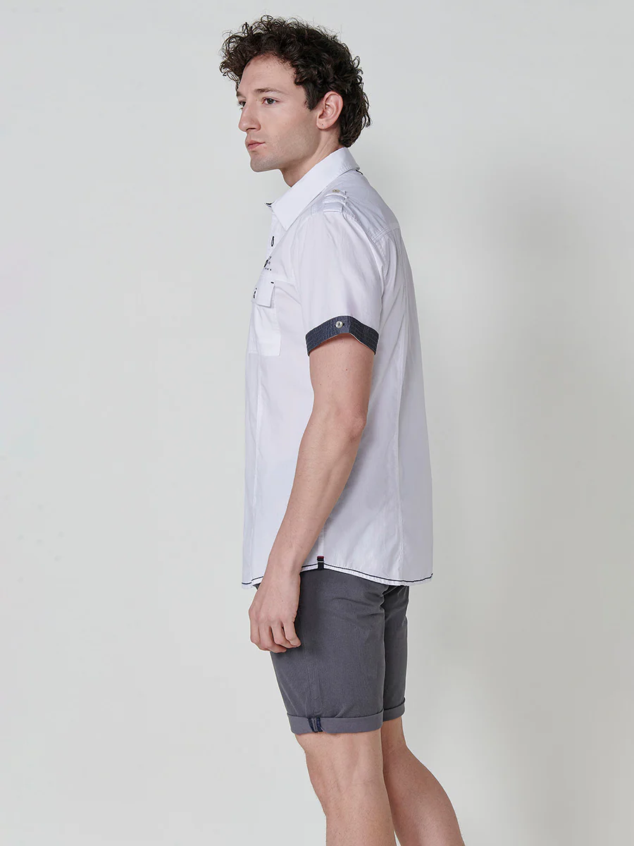 Camisa de manga corta de algodón. puños vueltos, cierre con botones y bolsillos con solapa. - Image 5
