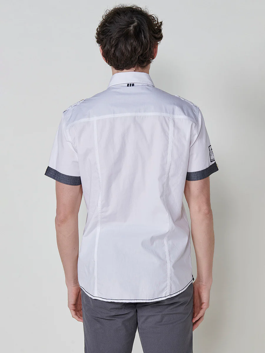Camisa de manga corta de algodón. puños vueltos, cierre con botones y bolsillos con solapa. - Image 7