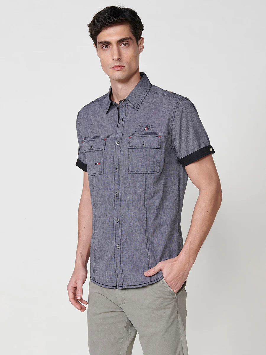Camisa de manga corta de algodón. puños vueltos, cierre con botones y bolsillos con solapa. - Image 8