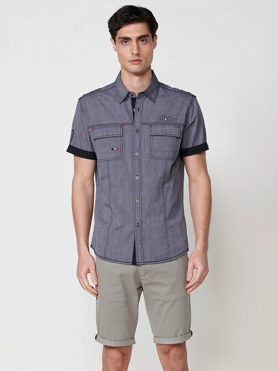 Camisa de manga corta de algodón. puños vueltos, cierre con botones y bolsillos con solapa. - Image 9